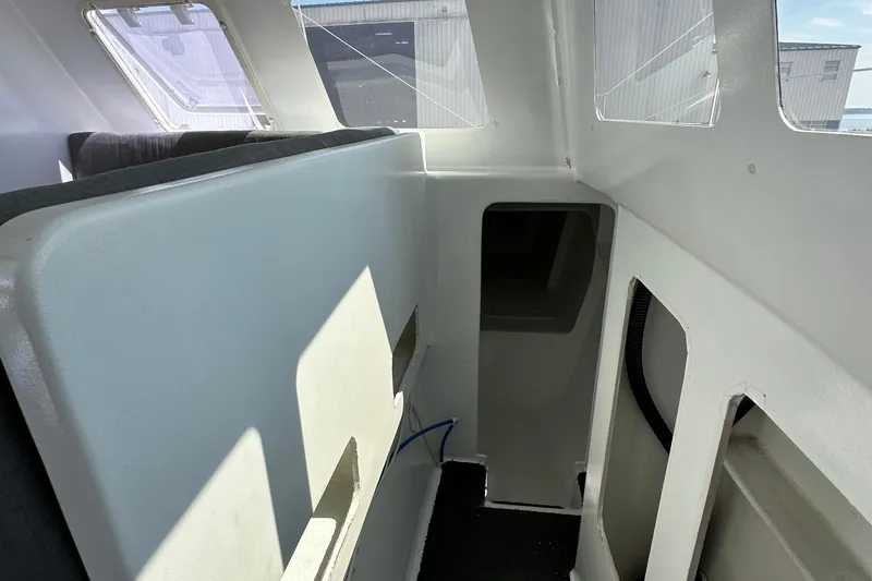 Slide: The Image of Interior of a 2019 Kelsall 38ma catamaran, featuring modern design and ample natural light. - 37