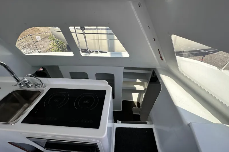 Slide: The Image of Interior of 2019 Kelsall 38ma yacht with modern kitchen and large windows. - 44