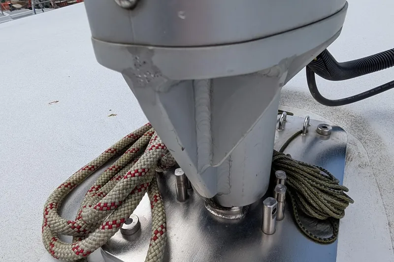 Slide: The Image of Close-up of a Kelsall 38ma 2019 sailboat mast base with ropes and fittings. - 57