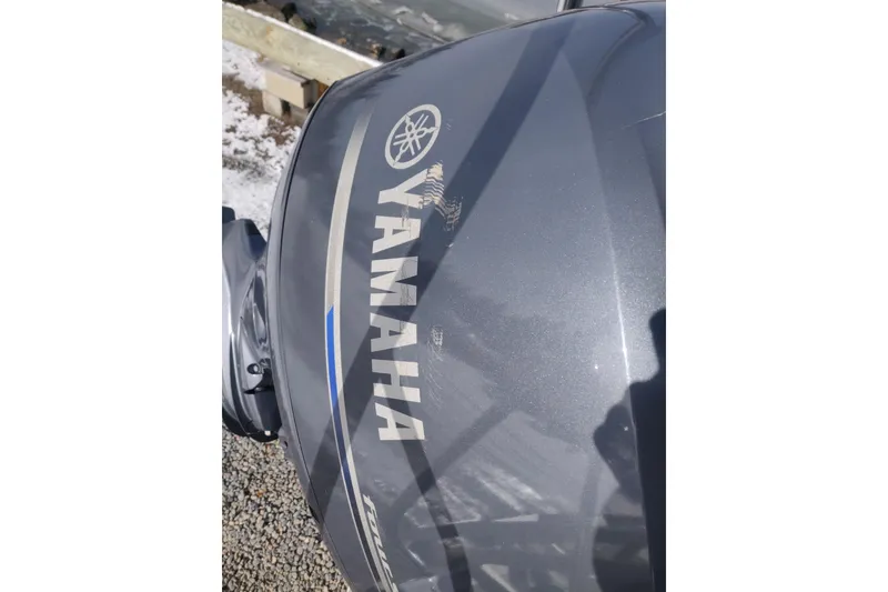 Slide: The Image of 2023 Bennington 21LSB with Yamaha outboard motor, close-up view. - 15