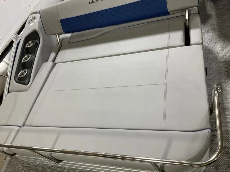 Slide: The Image of 2023 Bennington 21LSB pontoon boat interior at a marina dock. - 4