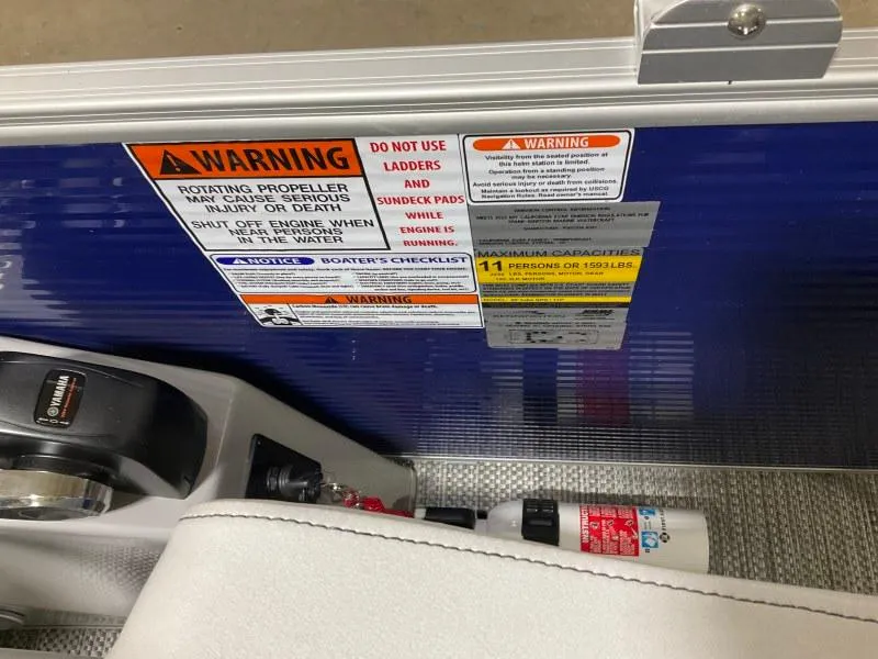 Slide: The Image of 2023 Bennington 21LSB boat interior with steering wheel and seating area. - 9