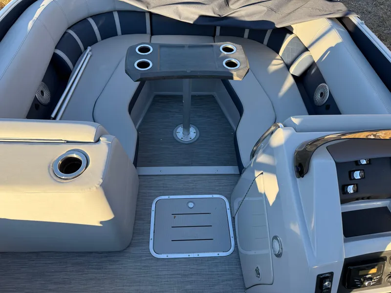 Slide: The Image of Interior of 2023 Bennington 23LTSB boat with safety warnings and fire extinguisher. - 15