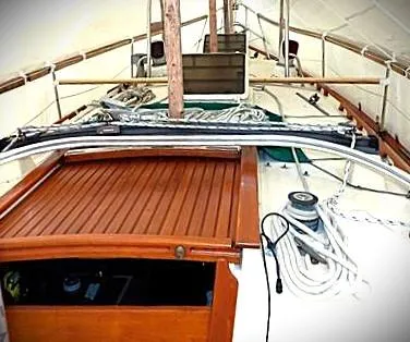 Slide: The Image of 1990 Pacific Seacraft 37 sailboat deck with wooden hatch and rigging. - 6