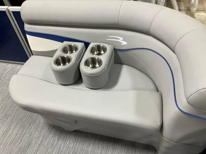 Slide: The Image of 2023 Bennington 208SL pontoon boat on trailer under cloudy sky. - 12