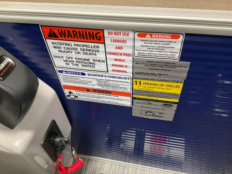 Slide: The Image of 2023 Bennington 208SL pontoon boat with Yamaha outboard motor on trailer. - 15