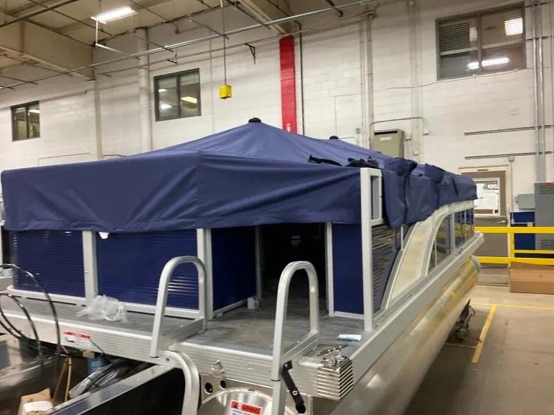 Slide: The Image of 2023 Bennington 208SL boat dashboard with steering wheel and controls. - 6