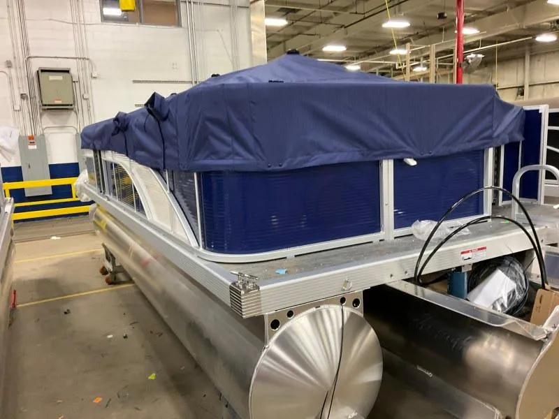 Slide: The Image of 2023 Bennington 208SL pontoon boat interior with gray seating and cup holders. - 7