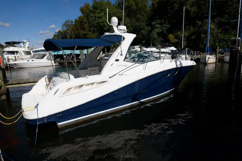 The Image of 2009 Sea Ray 330 Sundancer yacht docked in a marina. - 1