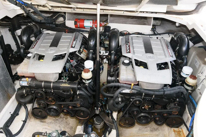 Slide: The Image of Twin engines in a 2009 Sea Ray 330 Sundancer boat engine room. - 21