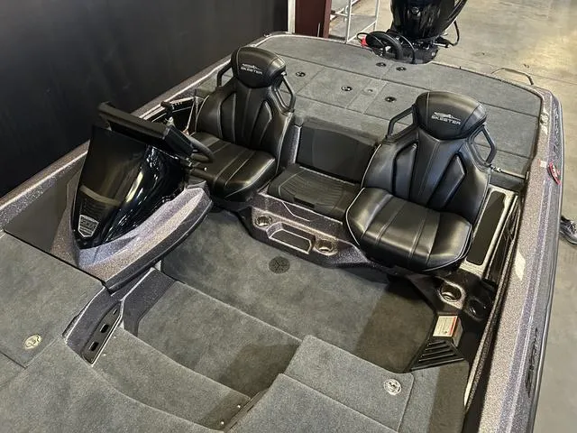 Slide: The Image of 2024 Skeeter ZXR 19 boat interior with Yamaha 225 SHO engine, featuring sleek black seating. - 12