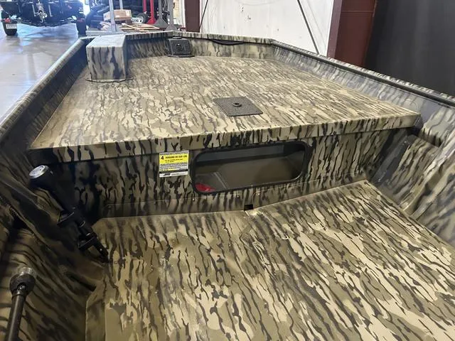 Slide: The Image of 2025 SeaArk 1648 Special boat interior with camouflage design, no motor. - 7