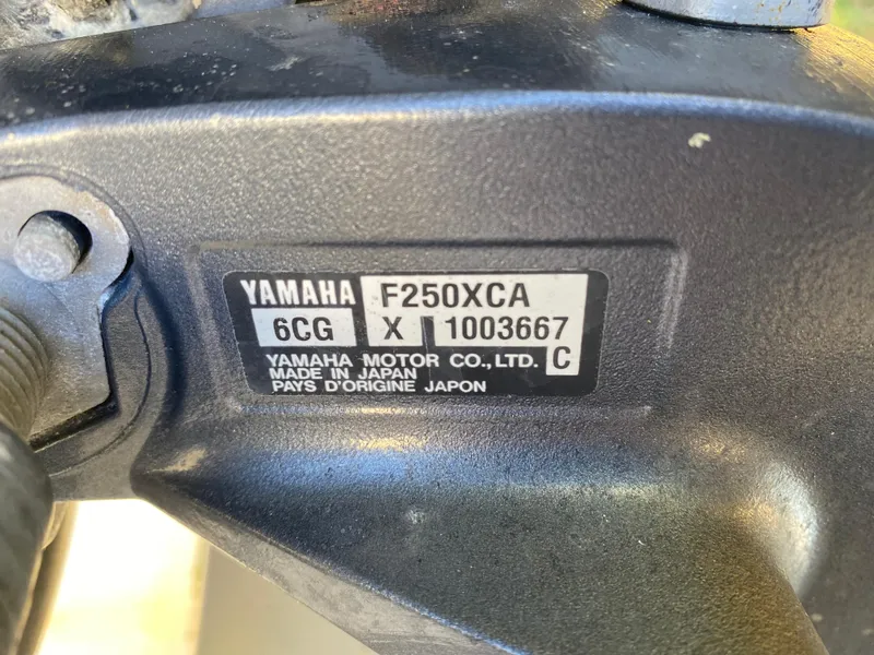 Slide: The Image of Yamaha F250XCA engine label on 2013 Pursuit DC 235 Dual Console boat. - 12