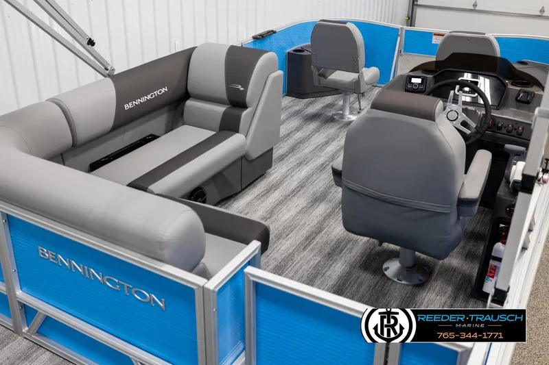 Slide: The Image of 2025 Bennington 16 SFSE pontoon boat interior with gray seating and blue accents. - 12