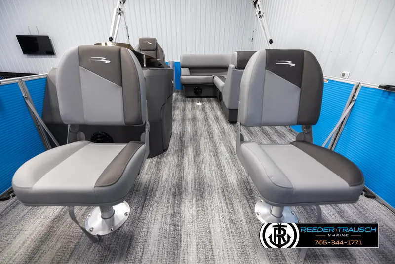 Slide: The Image of 2025 Bennington 16 SFSE boat interior with gray seating and blue accents. - 13