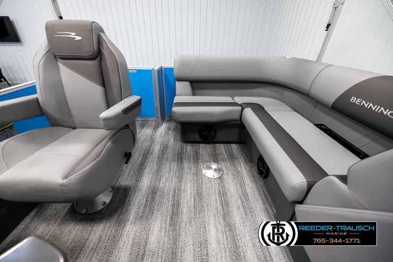 Slide: The Image of 2025 Bennington 16 SFSE boat interior with gray seating and carpeted flooring. - 14