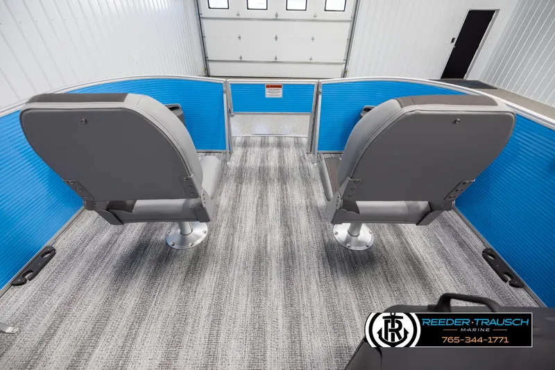 Slide: The Image of 2025 Bennington 16 SFSE boat interior with blue accents and two gray seats. - 16