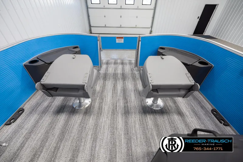 Slide: The Image of 2025 Bennington 16 SFSE boat interior with two gray seats and blue paneling. - 17