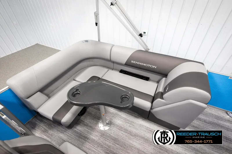 Slide: The Image of 2025 Bennington 16 SFSE boat interior with gray seating and table. - 21