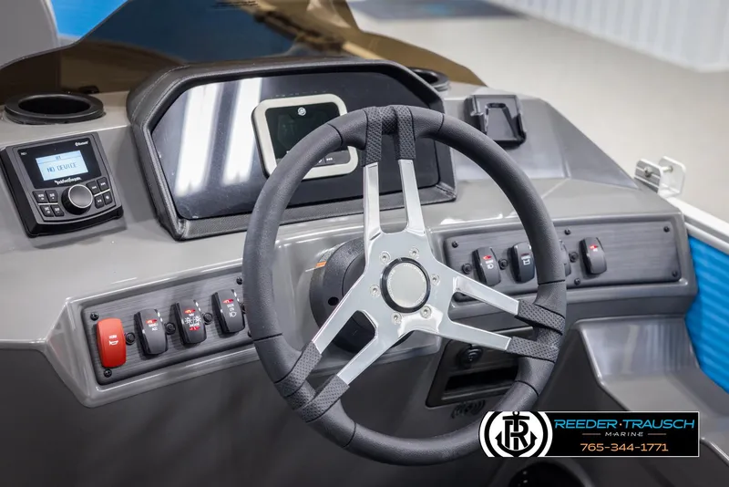 Slide: The Image of 2025 Bennington 16 SFSE boat dashboard with steering wheel and control panel. - 23