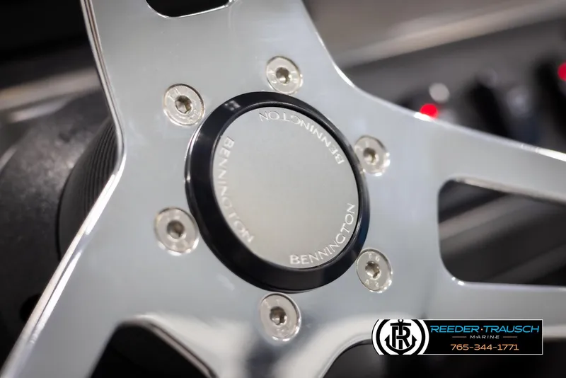 Slide: The Image of Close-up of 2025 Bennington 16 SFSE steering wheel with logo. - 24