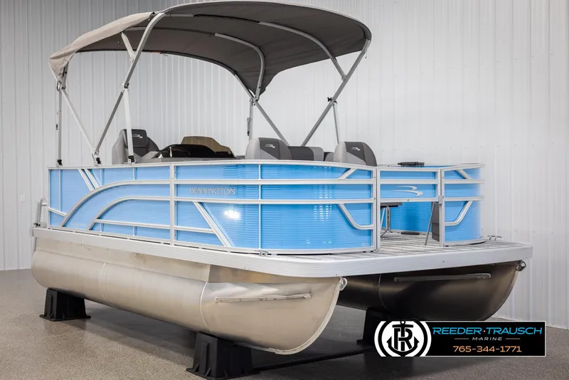 Slide: The Image of 2025 Bennington 16 SFSE pontoon boat with canopy in showroom. - 3