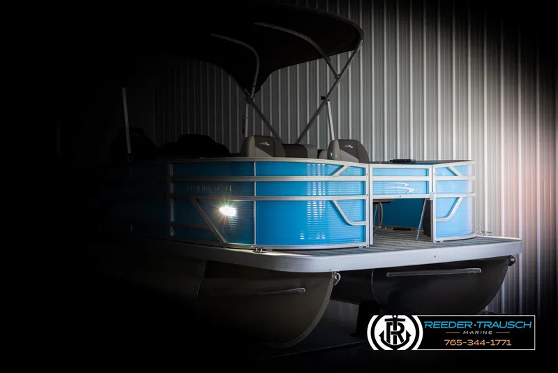 Slide: The Image of 2025 Bennington 16 SFSE pontoon boat in a dimly lit storage area. - 4