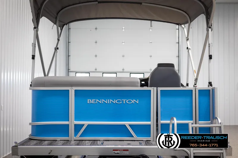 Slide: The Image of 2025 Bennington 16 SFSE pontoon boat in a showroom setting. - 7