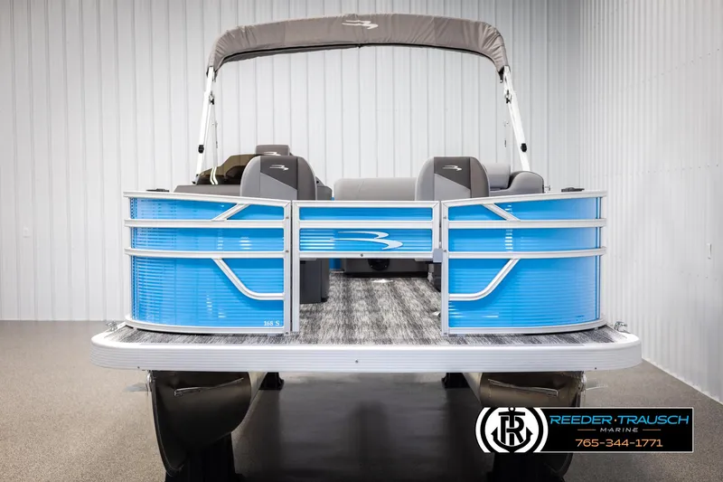 Slide: The Image of 2025 Bennington 16 SFSE pontoon boat with blue exterior in showroom. - 8