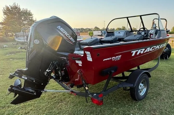 Slide: The Image of 2025 Tracker Pro Guide V-16 WT boat with Mercury engine on trailer. - 5