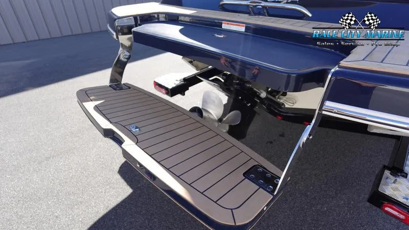 Slide: The Image of 2025 Chris-Craft Sportster boat with sleek swim platform and modern design. - 10