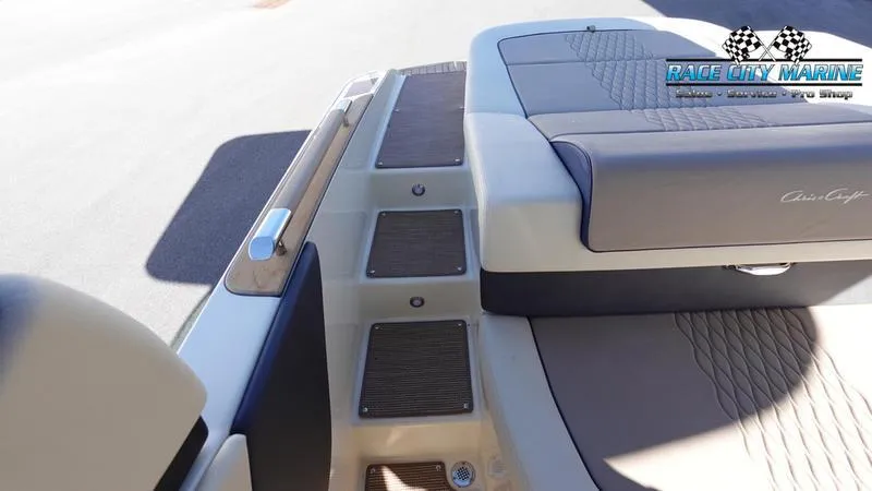 Slide: The Image of 2025 Chris-Craft Sportster boat deck with cushioned seating and non-slip steps. - 15