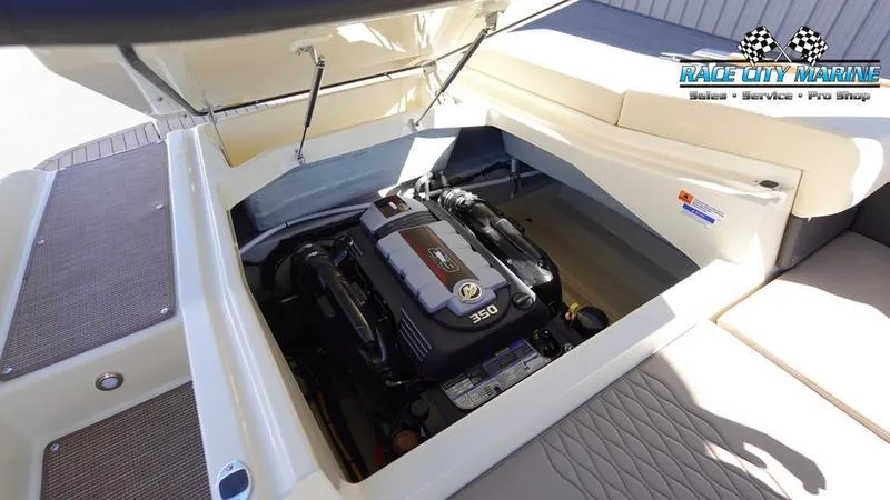 Slide: The Image of 2025 Chris-Craft Sportster engine compartment with open hatch, showcasing powerful 350 engine. - 17