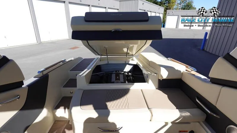 Slide: The Image of 2025 Chris-Craft Sportster boat interior with open engine compartment at Race City Marine. - 18