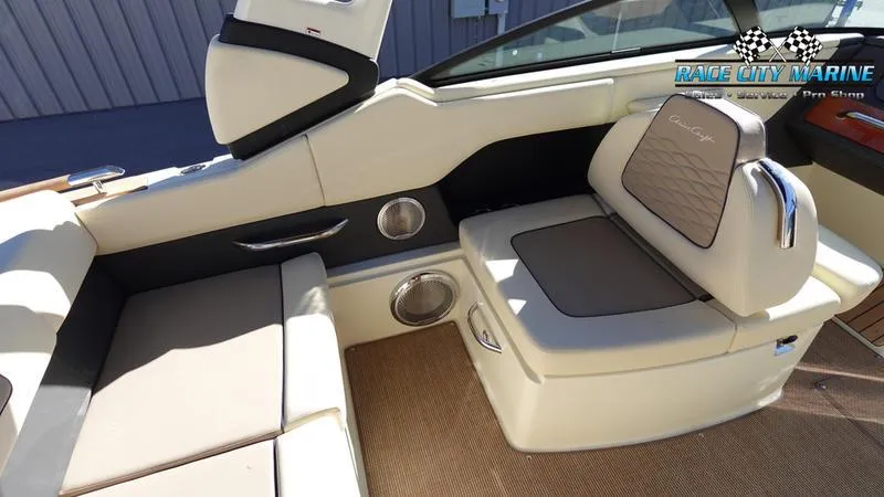 Slide: The Image of 2025 Chris-Craft Sportster boat interior with beige seating and modern design. - 19