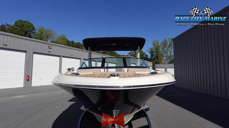 Slide: The Image of 2025 Chris-Craft Sportster boat at Race City Marine dealership. - 2