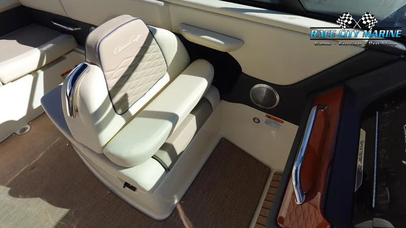 Slide: The Image of 2025 Chris-Craft Sportster boat interior with cushioned seating and elegant design. - 22