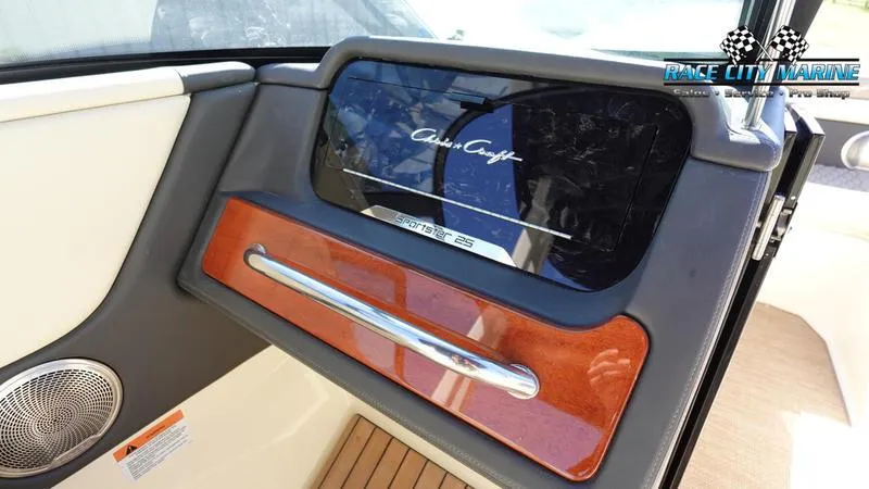 Slide: The Image of 2025 Chris-Craft Sportster dashboard with wood accents and sleek design. - 23