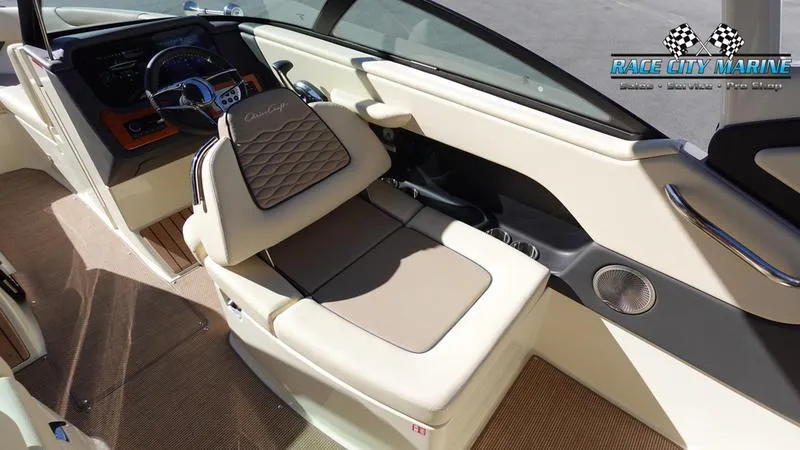 Slide: The Image of 2025 Chris-Craft Sportster boat interior with beige seating and modern dashboard. - 25