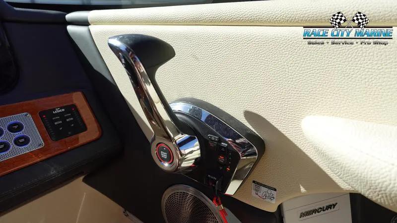 Slide: The Image of 2025 Chris-Craft Sportster boat throttle control in cockpit, Race City Marine branding visible. - 29