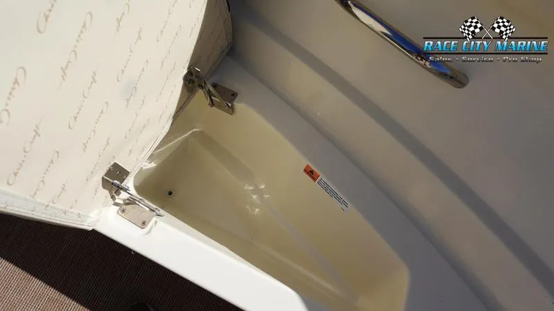 Slide: The Image of 2025 Chris-Craft Sportster storage compartment with Race City Marine branding. - 41