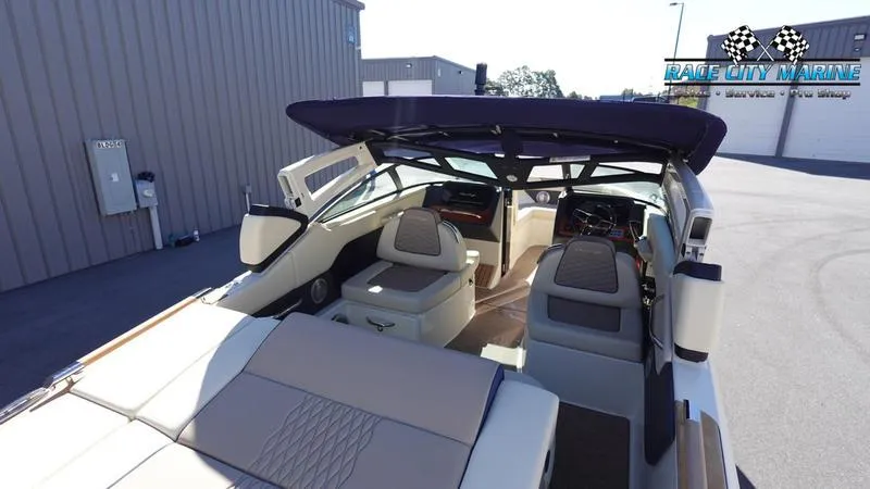 Slide: The Image of 2025 Chris-Craft Sportster boat interior with seating and canopy at Race City Marine. - 46