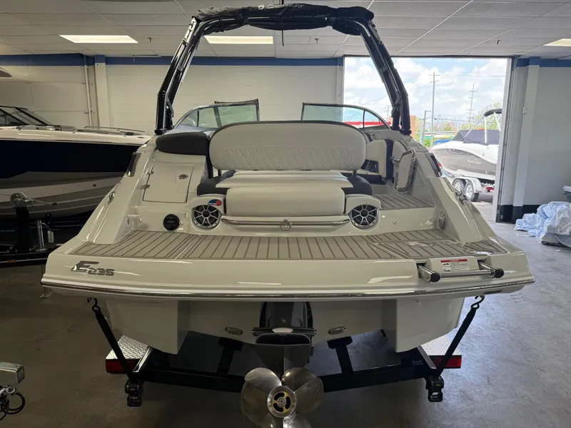 Slide: The Image of 2025 Crownline Eclipse E235 boat interior with luxurious seating and modern dashboard. - 1