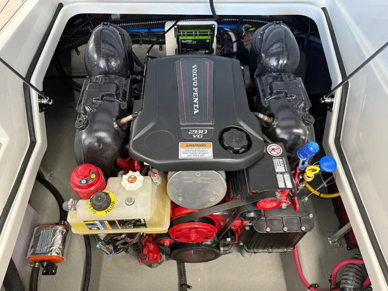 Slide: The Image of Throttle control of a 2025 Crownline Eclipse E235 boat with Volvo Penta branding. - 10