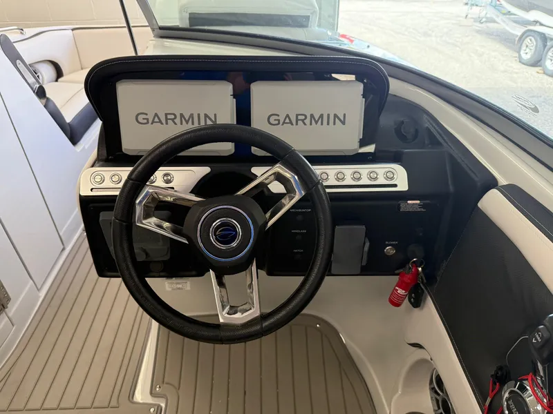 Slide: The Image of 2025 Crownline Eclipse E235 boat deck with textured panels and latch. - 5