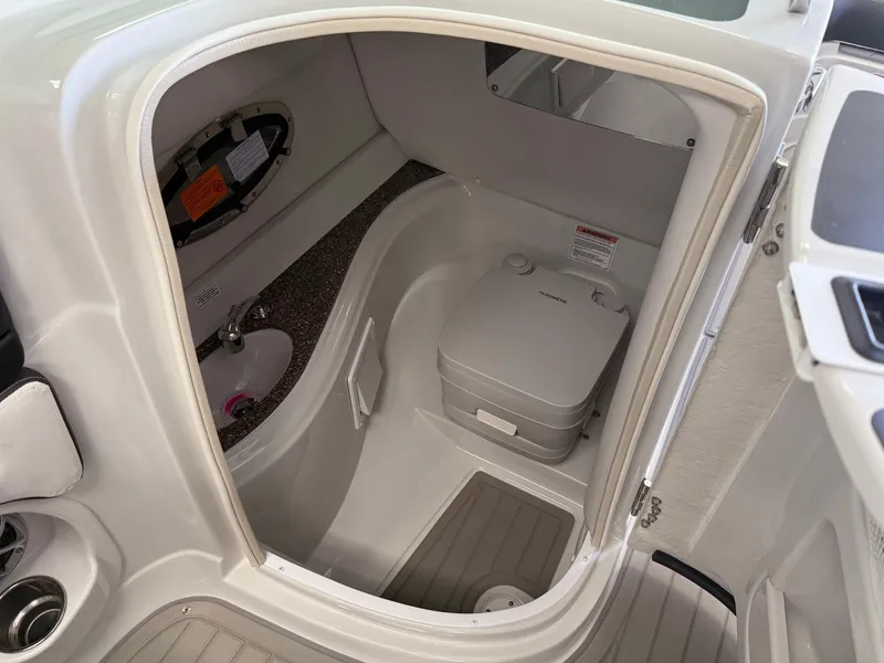 Slide: The Image of 2025 Crownline Eclipse E235 boat interior with seating and windshield. - 7