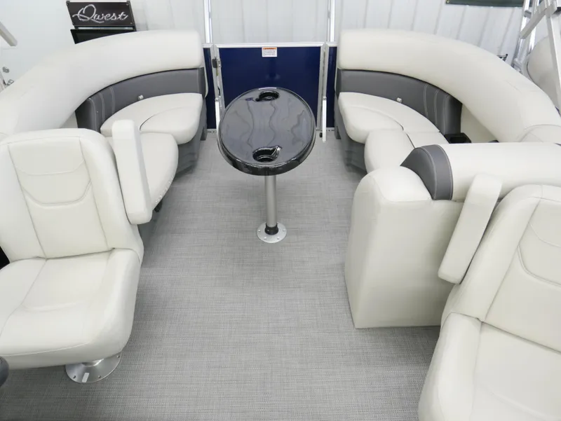 Slide: The Image of 2025 Sylvan Mirage 8520 LZ interior with plush seating and central table. - 13