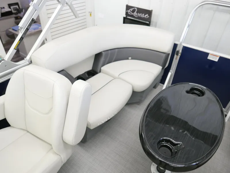 Slide: The Image of Luxurious interior of 2025 Sylvan Mirage 8520 LZ pontoon boat with plush seating and table. - 16
