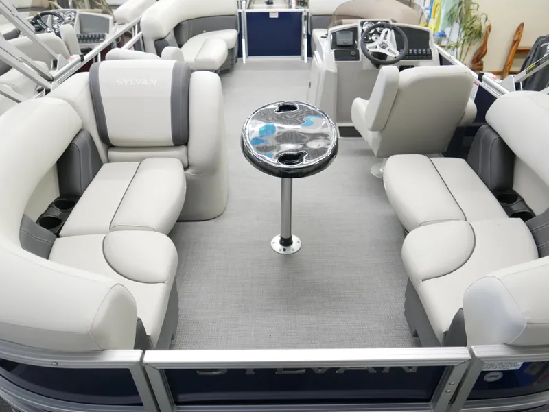 Slide: The Image of 2025 Sylvan Mirage 8520 LZ pontoon boat interior with plush seating and sleek design. - 20