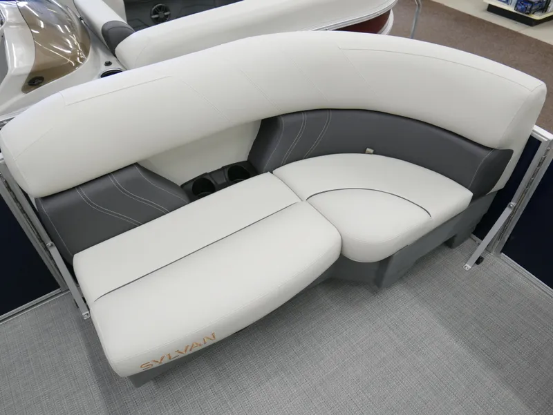 Slide: The Image of Luxurious seating on 2025 Sylvan Mirage 8520 LZ pontoon boat, featuring elegant white and gray upholstery. - 5